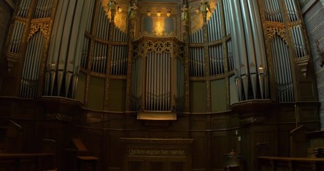 interior of an old church organ alter stained glass dolly