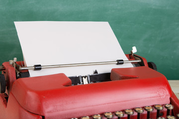 vintage typewriter on the table with blank paper - concept for writing, journalism, blogging