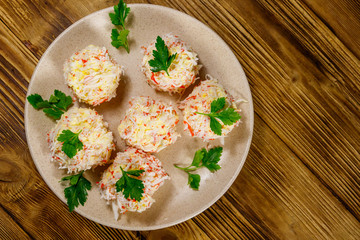 Appetizer of crab-cheese balls on wooden table. Top view