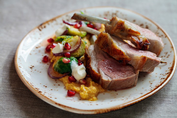 Lamb with pumpkin puree, brussel sprouts and pomegranate 
