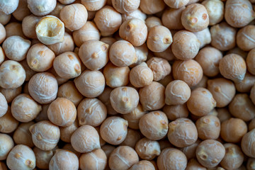 Uncooked chickpeas texture. Heap of chick peas as detailed macro shot