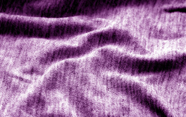 Fototapeta na wymiar Textile texture with blur effect in purple color.