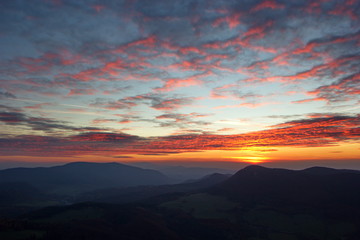 unusual clouds over mountains in sunset time