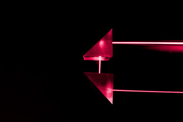 Laser beam and optical glass on black background