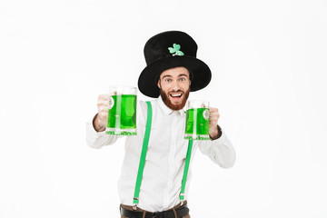 Cheerful young man celebrating St.Patrick 's Day