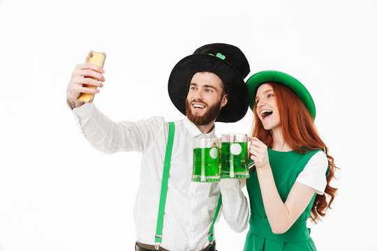 Happy young couple wearing costumes, celebrating