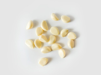 Fototapeta na wymiar Garlic cloves on the white background