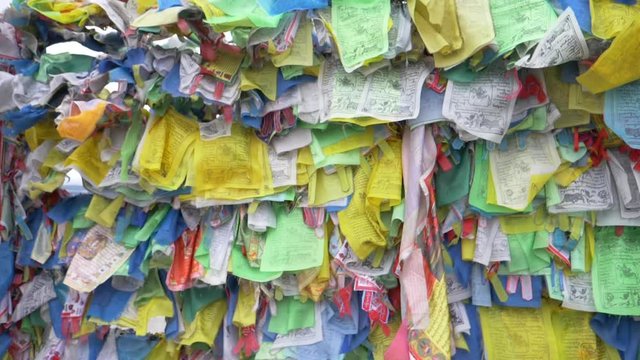 Colorful Tibetan prayer flags swaying in the wind in the temple, Ulan Ude Russia