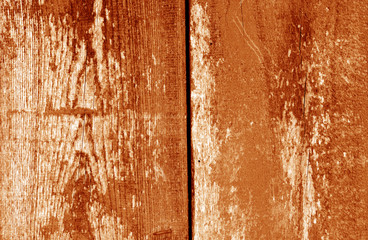 Old grungy wooden planks background in orange tone.