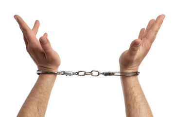 Closeup of handcuffed hands rised.