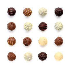 Top view of various chocolate pralines isolated on white background - obrazy, fototapety, plakaty
