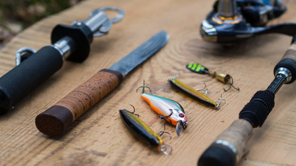 Fishing equipment still life on wooden background