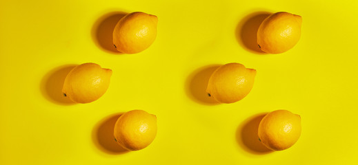 Lemon on yellow background. Flat lay, top view, copy space . Food concept.