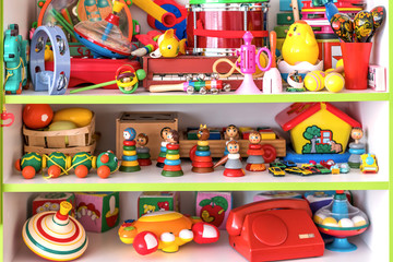 Fototapeta na wymiar plastic and wooden retro toys on the shelf