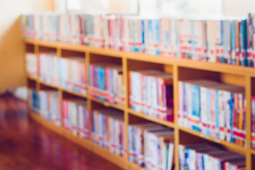 Blurred old books on bookshelf in library.  Education conecpt.