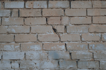 Background of old vintage dirty brick wall with peeling plaster, texture