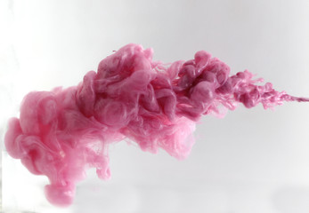 Fototapeta premium Pink, grey ink in water. Splash background, acrylic paint colorful.