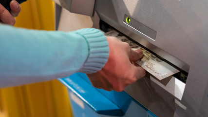 Obraz premium Press money from the ATM.
