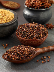 Indian clove arranged I a bowel on grey background