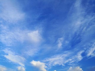 Naklejka na ściany i meble blue sky with white, soft clouds.The sky is clear.
