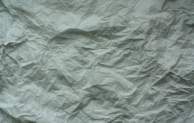White color crumpled sheet of paper.