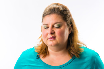 Close-up of fat annoyed woman