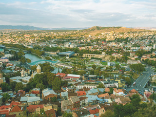 Beautiful panoramic view from the mountain to Old Town Tbilisi in autumn at sunset. Georgia