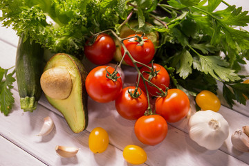 Tomato and vegetables on wooden floors