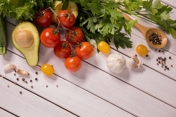 Tomato and vegetables on wooden floors