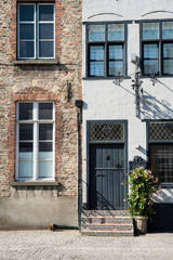 Fototapeta na wymiar house with black old door in Damme, Belgium