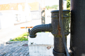old water pump on Haringmarkt in Damme, Belgium