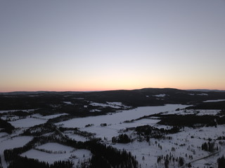 sunset over mountains snow on feilds