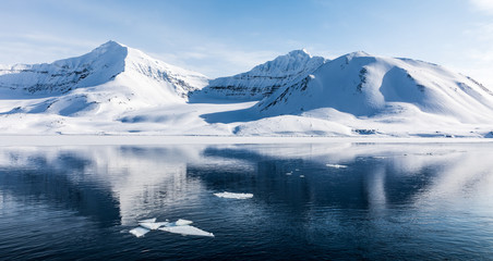 Fototapeta na wymiar Icy seascapes of Arctic Ocean.