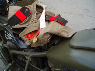 Fototapeta na wymiar soldier's jacket of the Soviet army in the second world war with the orders on a motorcycle