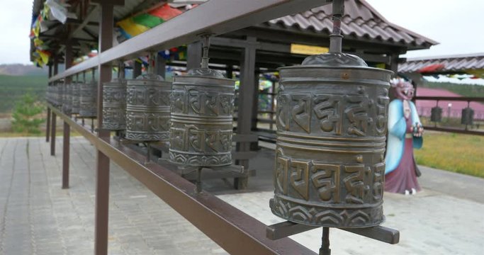 Tibetan prayer wheel rolling in the temple, Ulan Ude Russia
