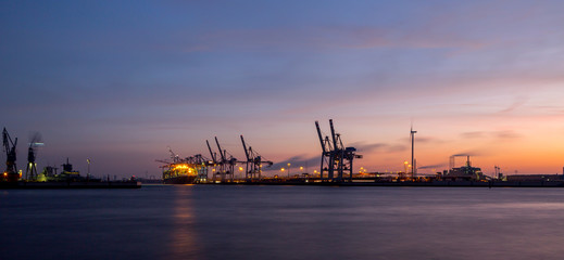 Fototapeta na wymiar Panorama of container port in Hamburg, Germany at night