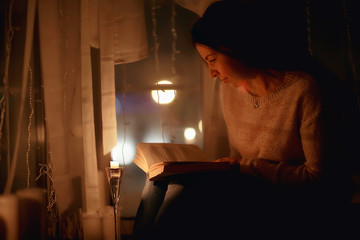 cozy Christmas evening girl / home New Year evening, model in a cozy house, evening light