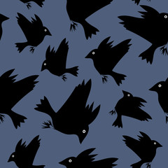 a flock of flying black birds. 