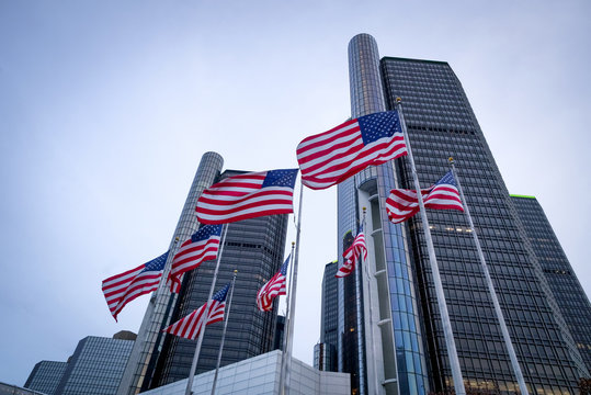 The Renaissance Center (RenCen) skyscrapers surrounded by American Flags in Downtown Detroit, Michigan, USA