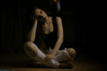 Studio portrait of a beautiful brunette on a black background