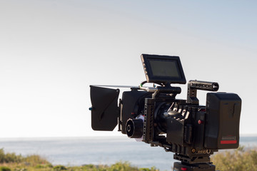 Video camera on the set, sea and sky