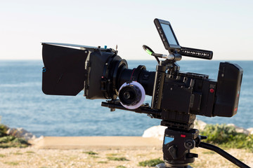 Video or movie production with a camera and sea background