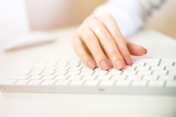 Typing on the keyboard, the girl searches