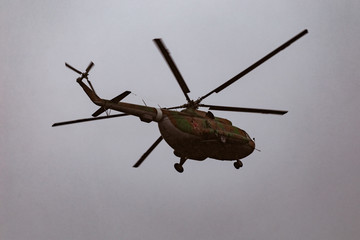 Fototapeta premium Mi-8 helicopters in the cloudy sky