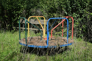 rusty playground merry-go-round