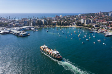 Fototapeta na wymiar Aerial view of the Circular Quay ferry approaching Manly Wharf and harbour in Sydney, Australia