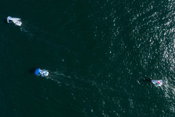 Sydney Australia April 6th 2019 : Aerial view of 3 Mirror sailing boats in Manly harbour