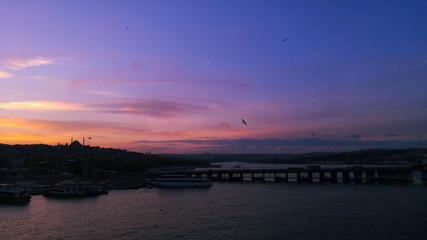 Fototapeta na wymiar Wonderful sunset over the bridges of the Golden Horn in Istanbul