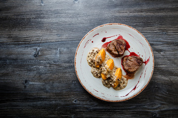 top view grilled meat steak with blood with potato zrazy