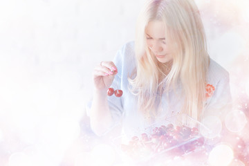 cute girl eating cherry / concept healthy eating, happy sexy young adult model and cherry berries